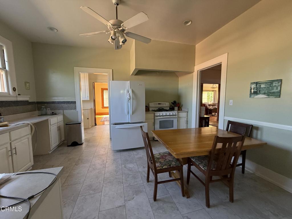 4645 Walnut Avenue Somis, CA 93066 - Photo 22 of 28 a dining room with a wooden table and chairs