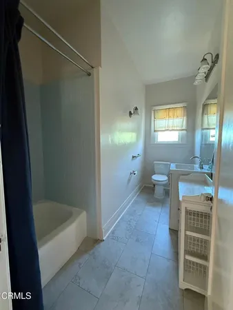 a kitchen with stainless steel appliances granite countertop a stove and a wooden cabinets