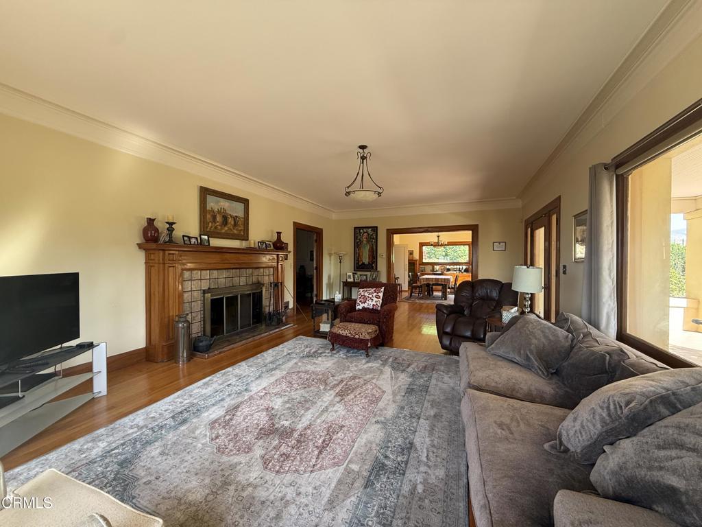 4645 Walnut Avenue Somis, CA 93066 - Photo 26 of 28 a living room with furniture a fireplace and a flat screen tv