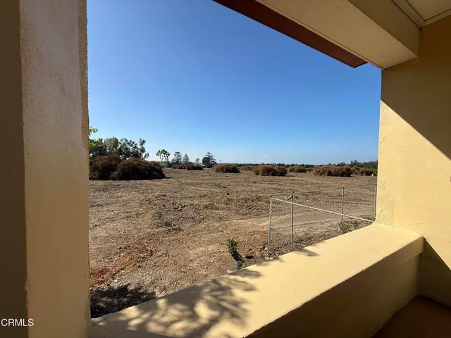 a table and chairs in a balcony
