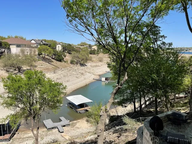 a view of a backyard of the house