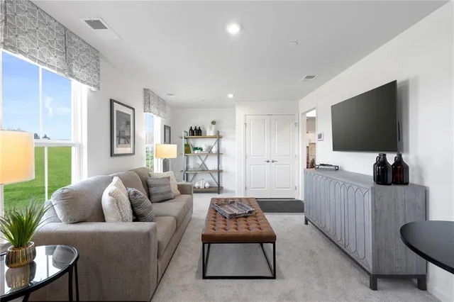 a living room with furniture and a window
