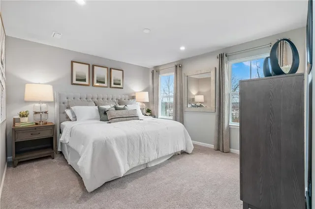 a bedroom with a bed and a dresser