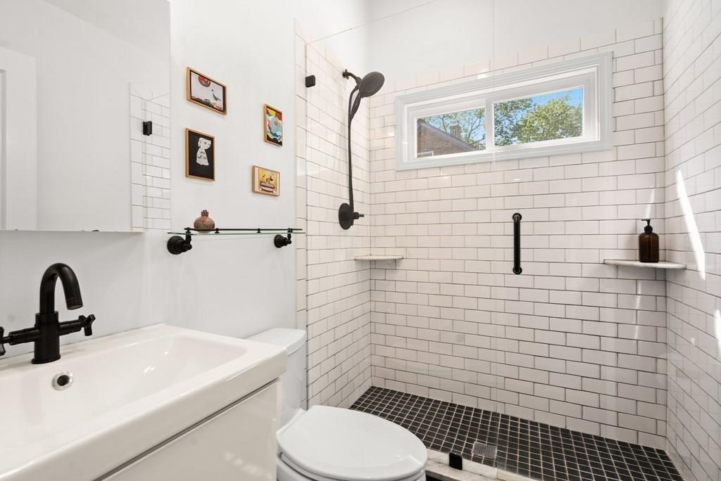 24 Cedarwood Road Boston, MA 02130 - Photo 11 of 18 a bathroom with a sink a toilet and shower
