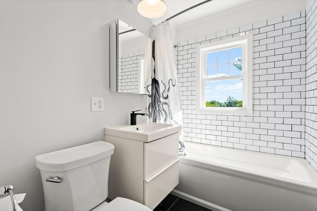 24 Cedarwood Road Boston, MA 02130 - Photo 13 of 18 a bathroom with a sink a toilet and a bathtub