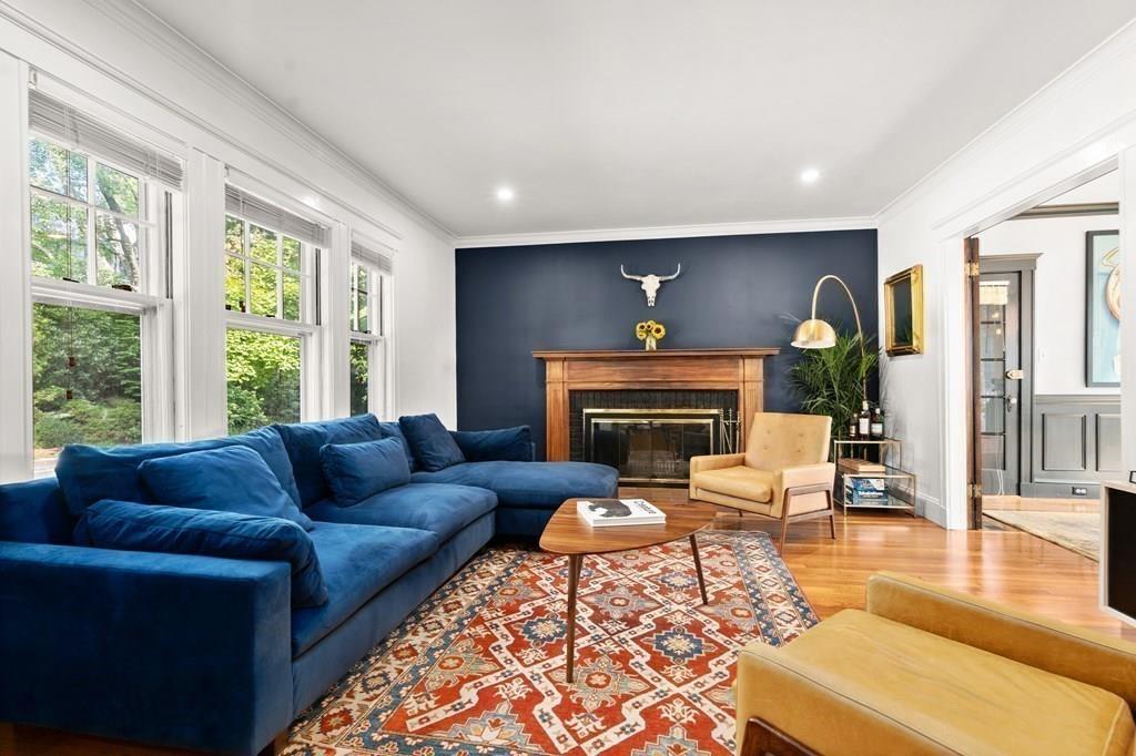 24 Cedarwood Road Boston, MA 02130 - Photo 3 of 18 a living room with furniture a rug a lamp and a fireplace