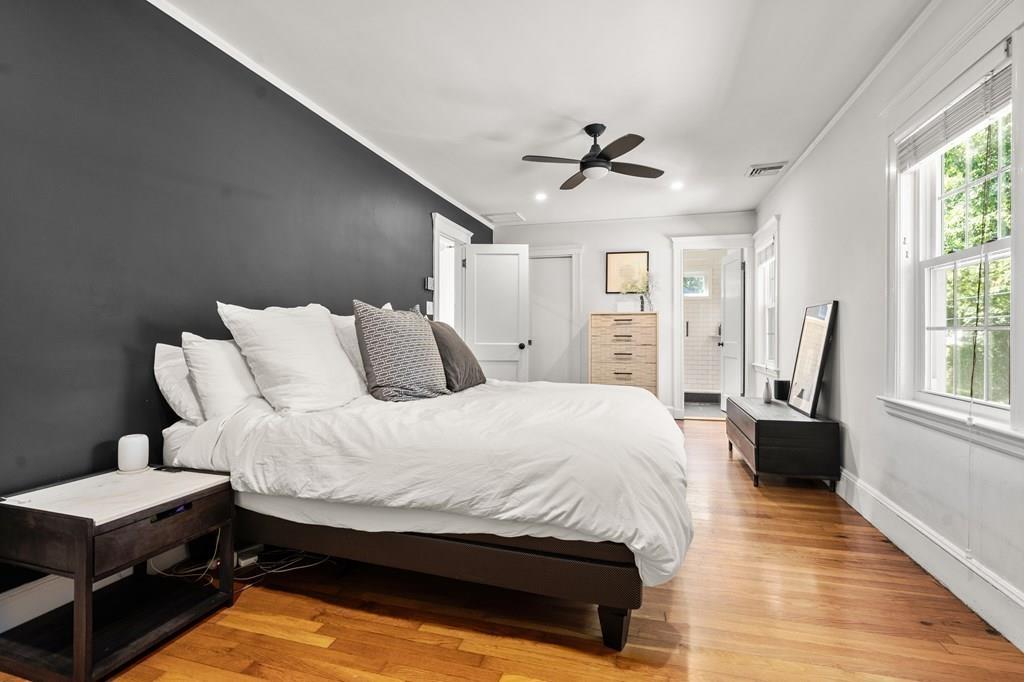 24 Cedarwood Road Boston, MA 02130 - Photo 10 of 18 a bedroom with a bed wooden floor and window