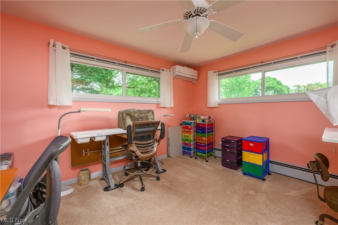 572 Overwood Road Akron, OH 44313 - Photo 16 of 35 Bedroom featuring a wealth of natural light, an AC wall unit