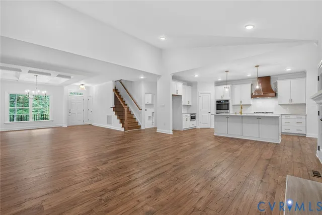 a view of kitchen with wooden floor and a sink
