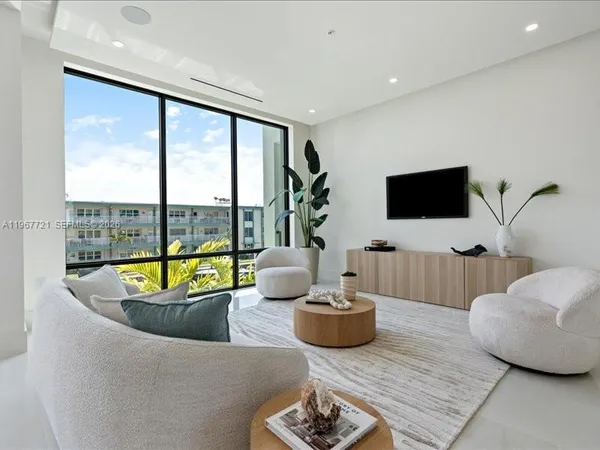 a living room with furniture and a table