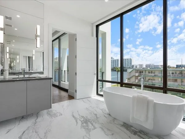 a kitchen with a sink and a mirror