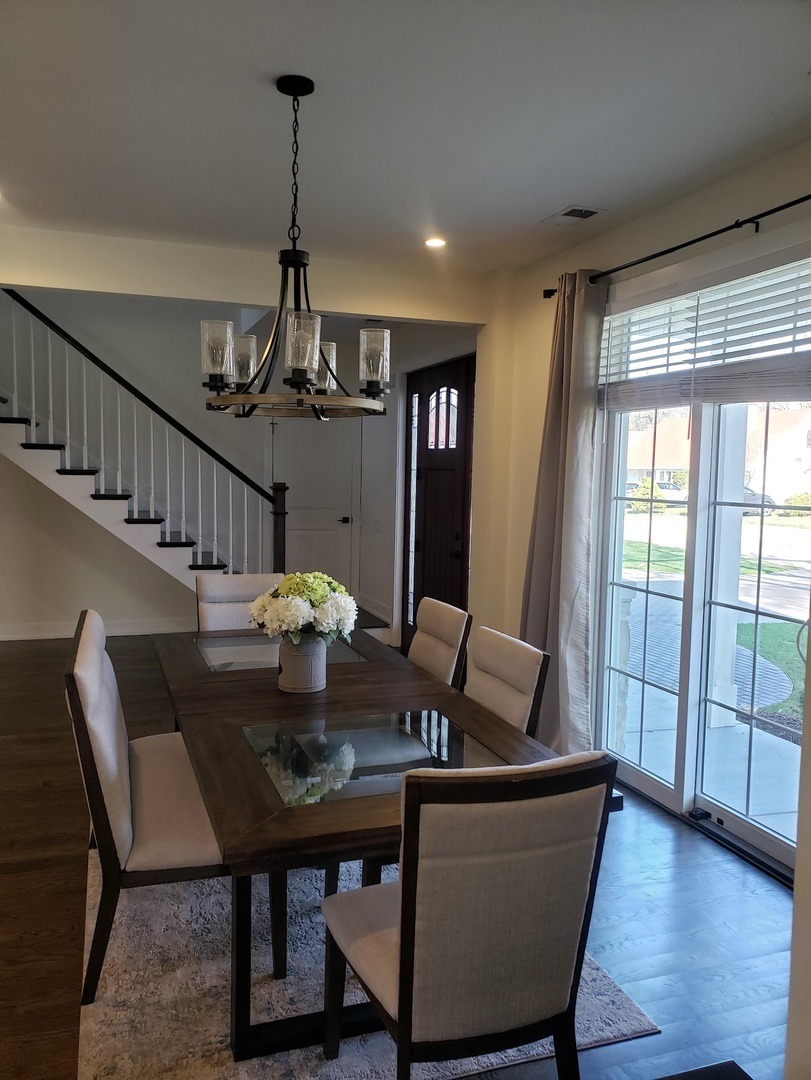 3101 Sprucewood Road Wilmette, IL 60091 - Photo 7 of 10 a view of a dining room with furniture window and wooden floor