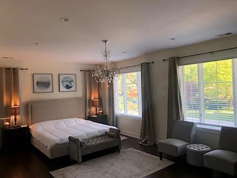 3101 Sprucewood Road Wilmette, IL 60091 - Photo 10 of 10 a bedroom with a bed mirror and window