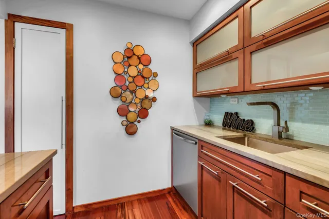 a kitchen with stainless steel appliances granite countertop a sink and a microwave