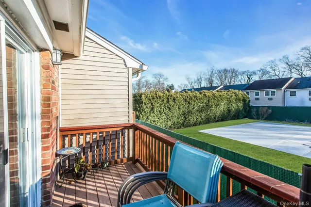 a view of a balcony with furniture