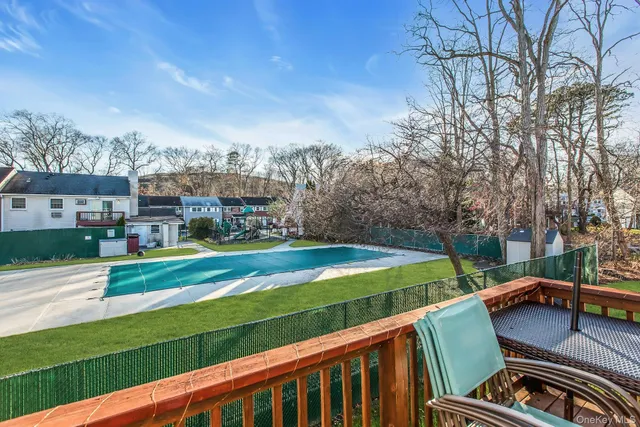 a view of a chairs and table on the deck