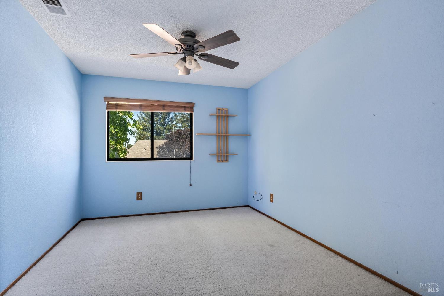 7408 Maximillian Place Rohnert Park, CA 94928 - Photo 10 of 19 Spacious bedroom with desirable west-facing exposure, offering abundant sunlight and pleasant sunset views. A comfortable retreat ready for your personal updates and design touches.