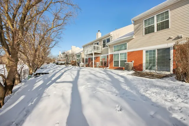 a view of a building with a snow on the road
