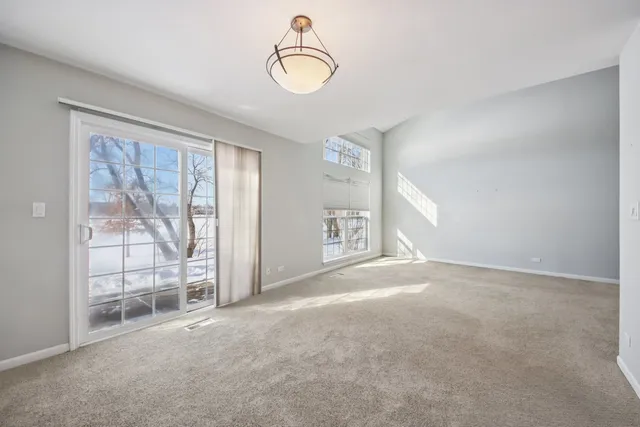 a view of empty room with floor to ceiling window