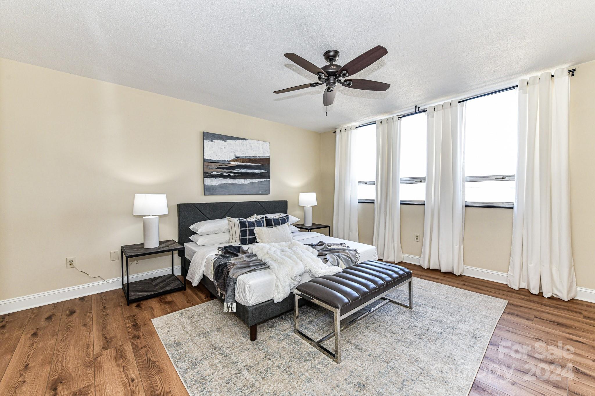 1300 Reece Road, Unit 415 Charlotte, NC 28209 - Photo 18 of 32 a bedroom with a bed and a window