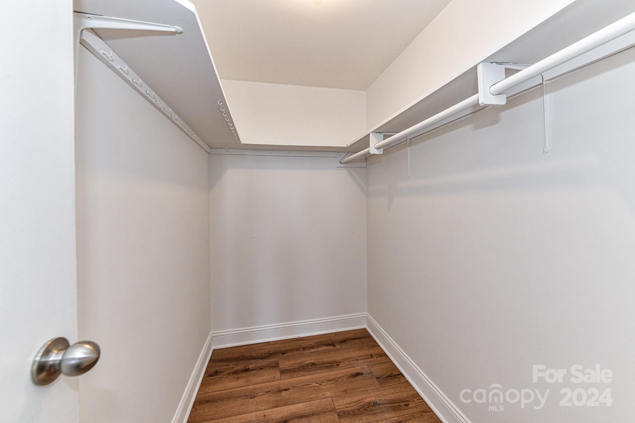 1300 Reece Road, Unit 415 Charlotte, NC 28209 - Photo 21 of 32 a view of room with racks on the wall