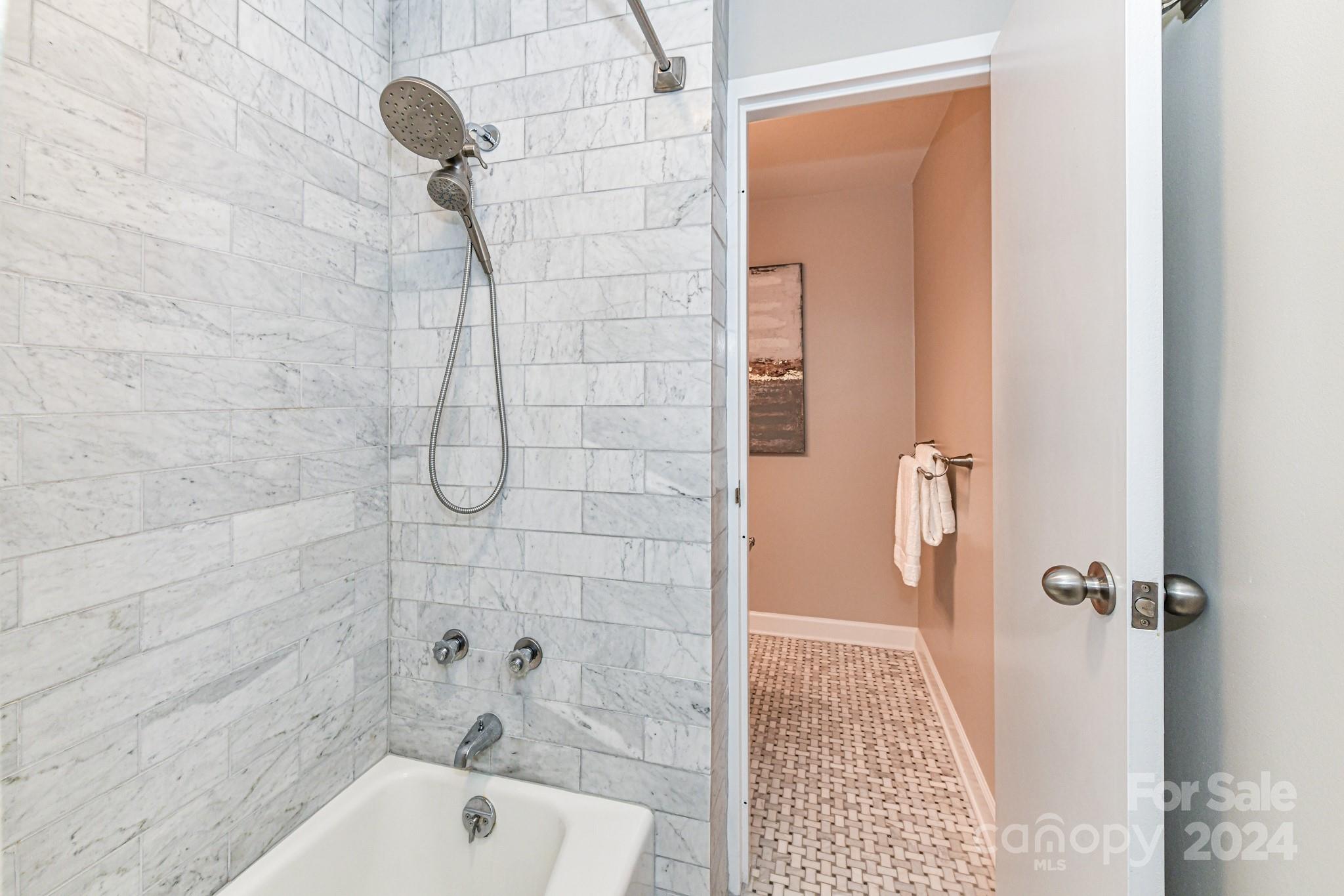 1300 Reece Road, Unit 415 Charlotte, NC 28209 - Photo 24 of 32 a bathroom with a shower