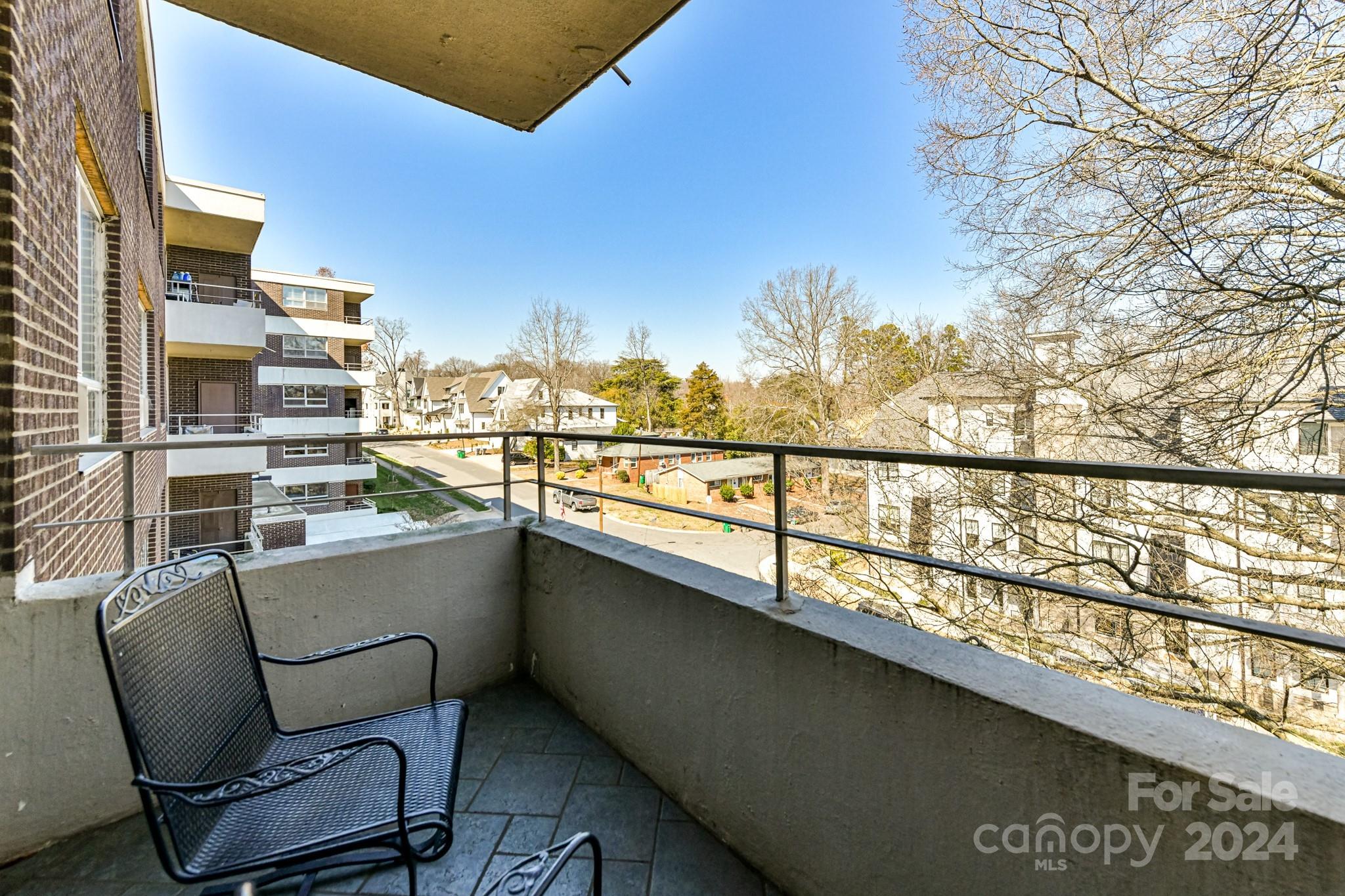 1300 Reece Road, Unit 415 Charlotte, NC 28209 - Photo 27 of 32 a view of a chairs and table in a balcony