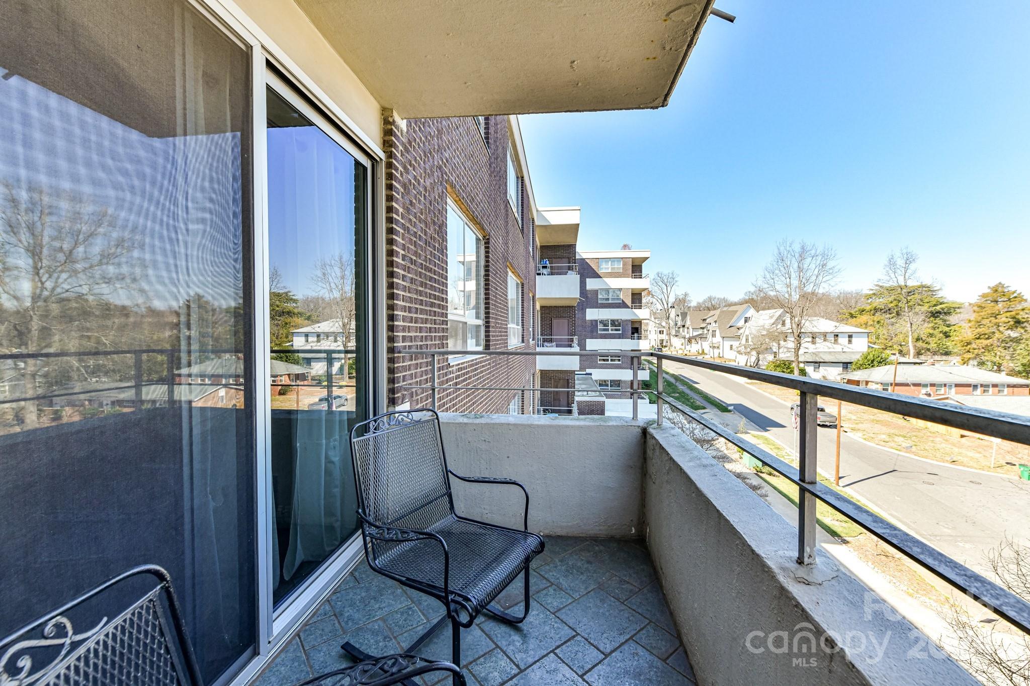 1300 Reece Road, Unit 415 Charlotte, NC 28209 - Photo 28 of 32 a view of balcony with furniture