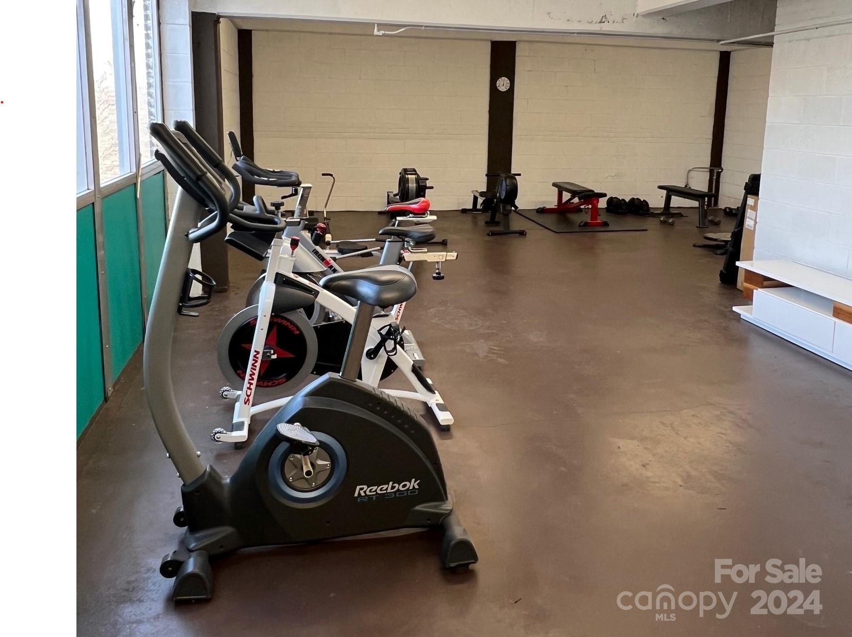 1300 Reece Road, Unit 415 Charlotte, NC 28209 - Photo 31 of 32 a view of a room with gym equipment