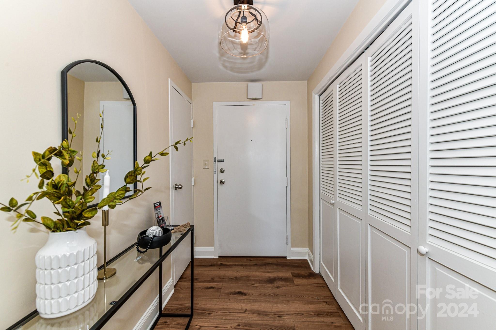 1300 Reece Road, Unit 415 Charlotte, NC 28209 - Photo 7 of 32 a view of entryway with wooden floor