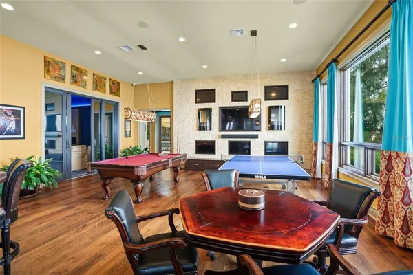 a view of a livingroom with furniture window and wooden floor