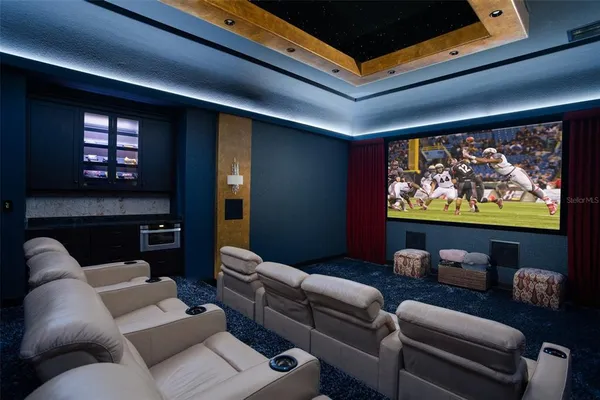 a outdoor space with lots of tables a large window and chairs