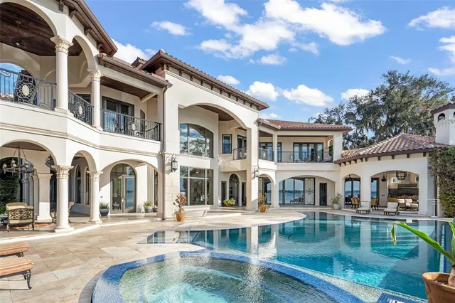 a front view of a house with a yard table and chairs