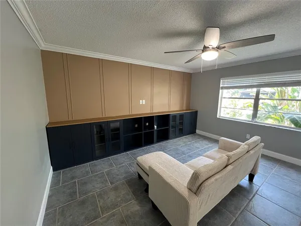 a living room with furniture and window