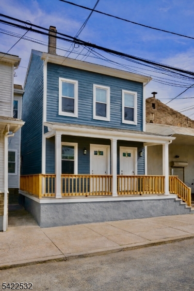 68 Arch Street Paterson, NJ 07522 - Photo 1 of 6 a front view of a house