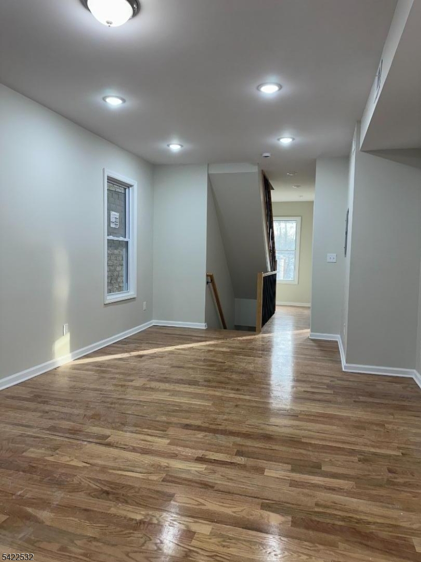 68 Arch Street Paterson, NJ 07522 - Photo 2 of 6 a view of empty room with wooden floor