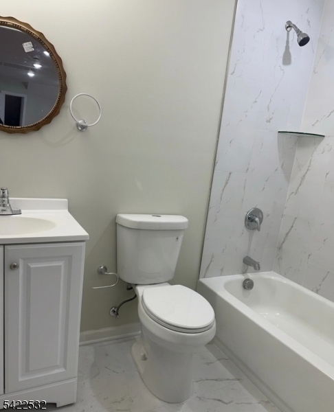 68 Arch Street Paterson, NJ 07522 - Photo 6 of 6 a bathroom with a toilet a sink and bathtub