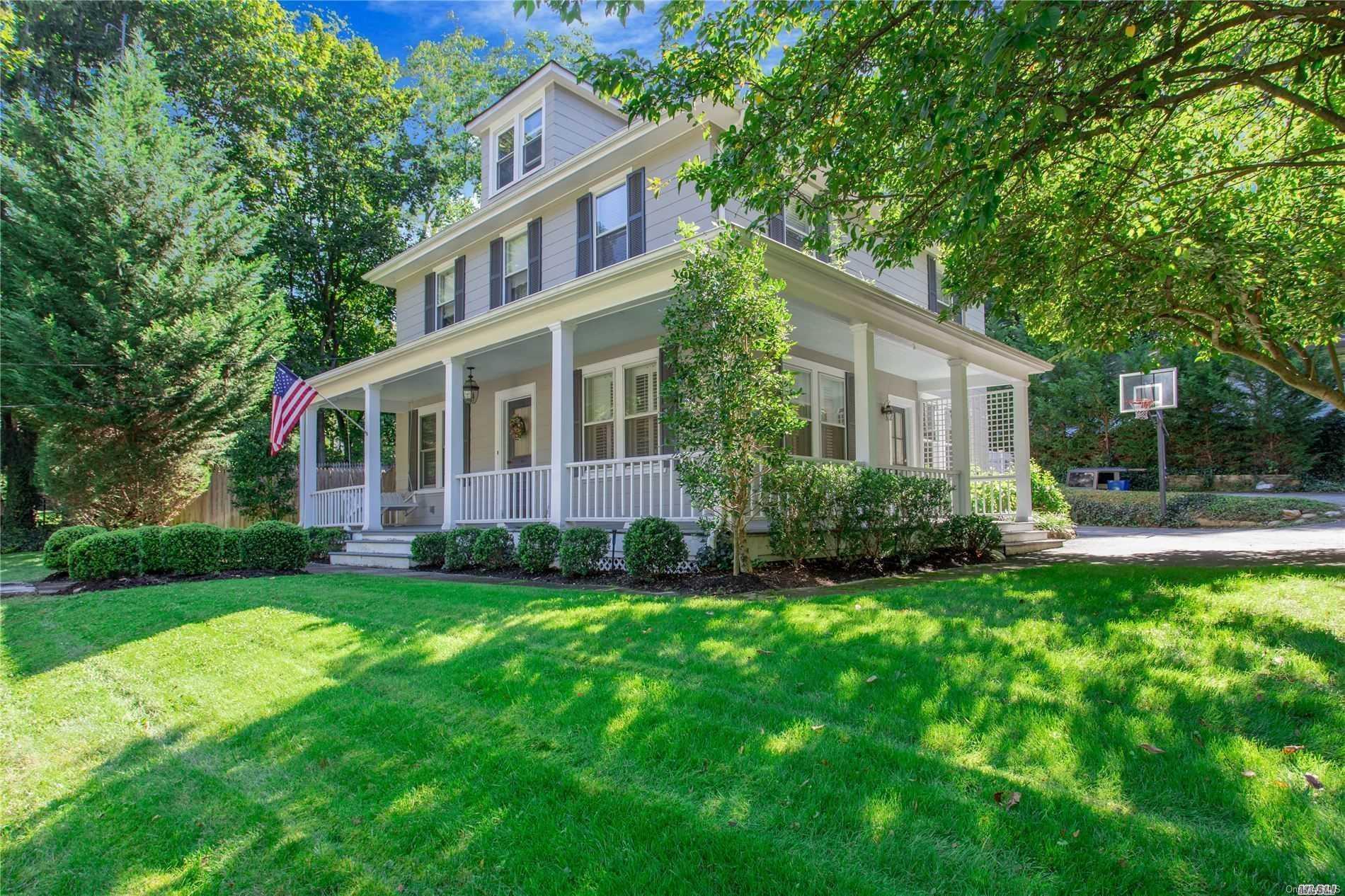 a view of a house with a yard and sitting area