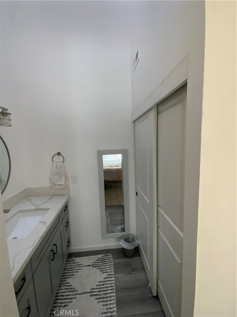 4140 Workman Mill Road, Unit 172 Whittier, CA 90601 - Photo 15 of 21 a bathroom with a granite countertop sink and a mirror