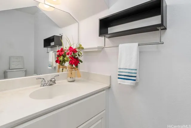 a bathroom with a sink and a mirror