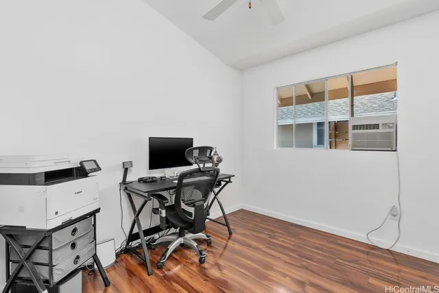 a workspace with furniture and wooden floor