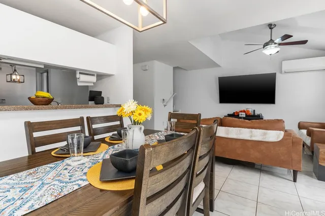 a bedroom with furniture and a flat screen tv