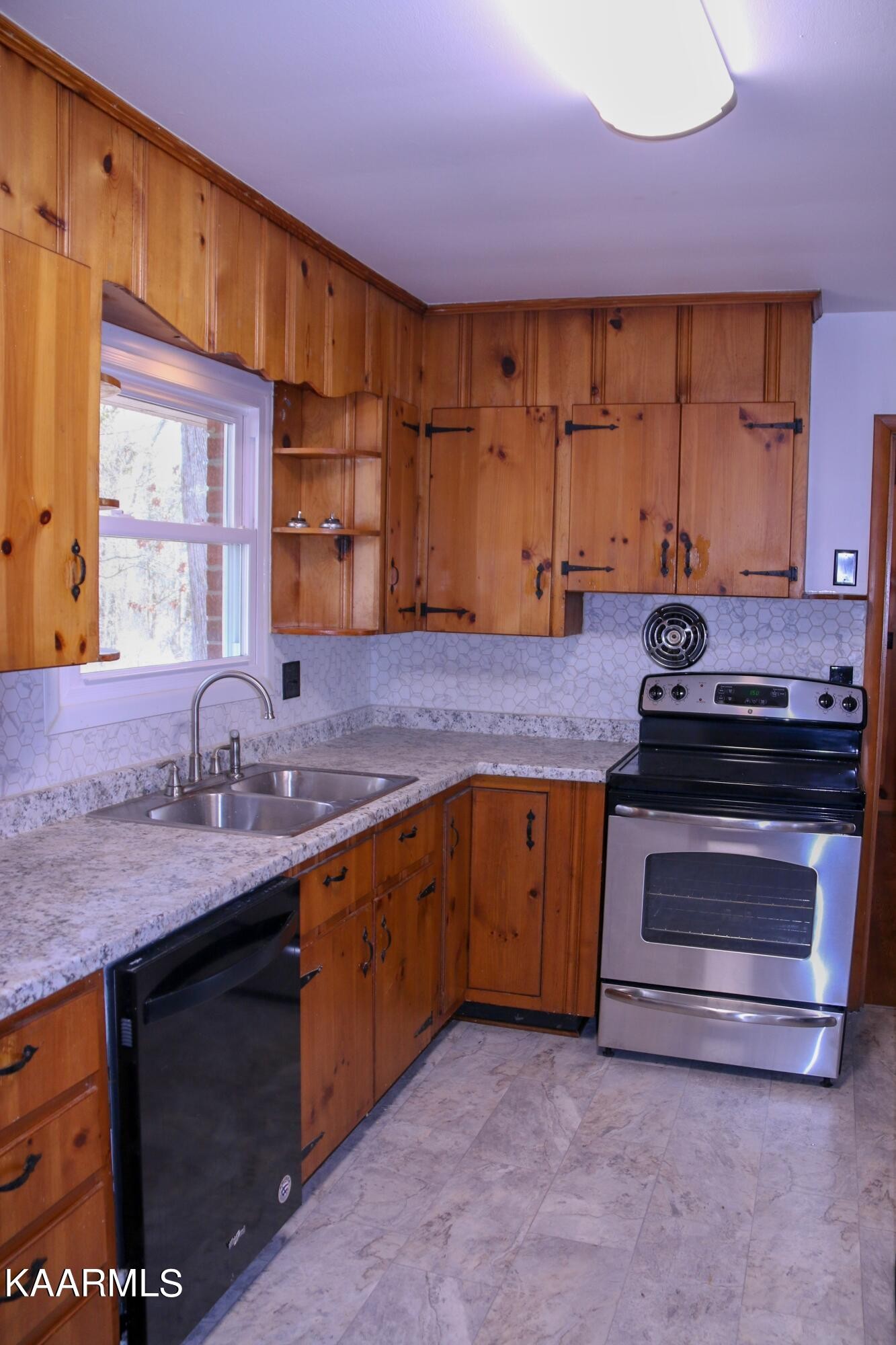 212 Kasson Road Knoxville, TN 37920 - Photo 3 of 22 a kitchen with a sink stove and cabinets