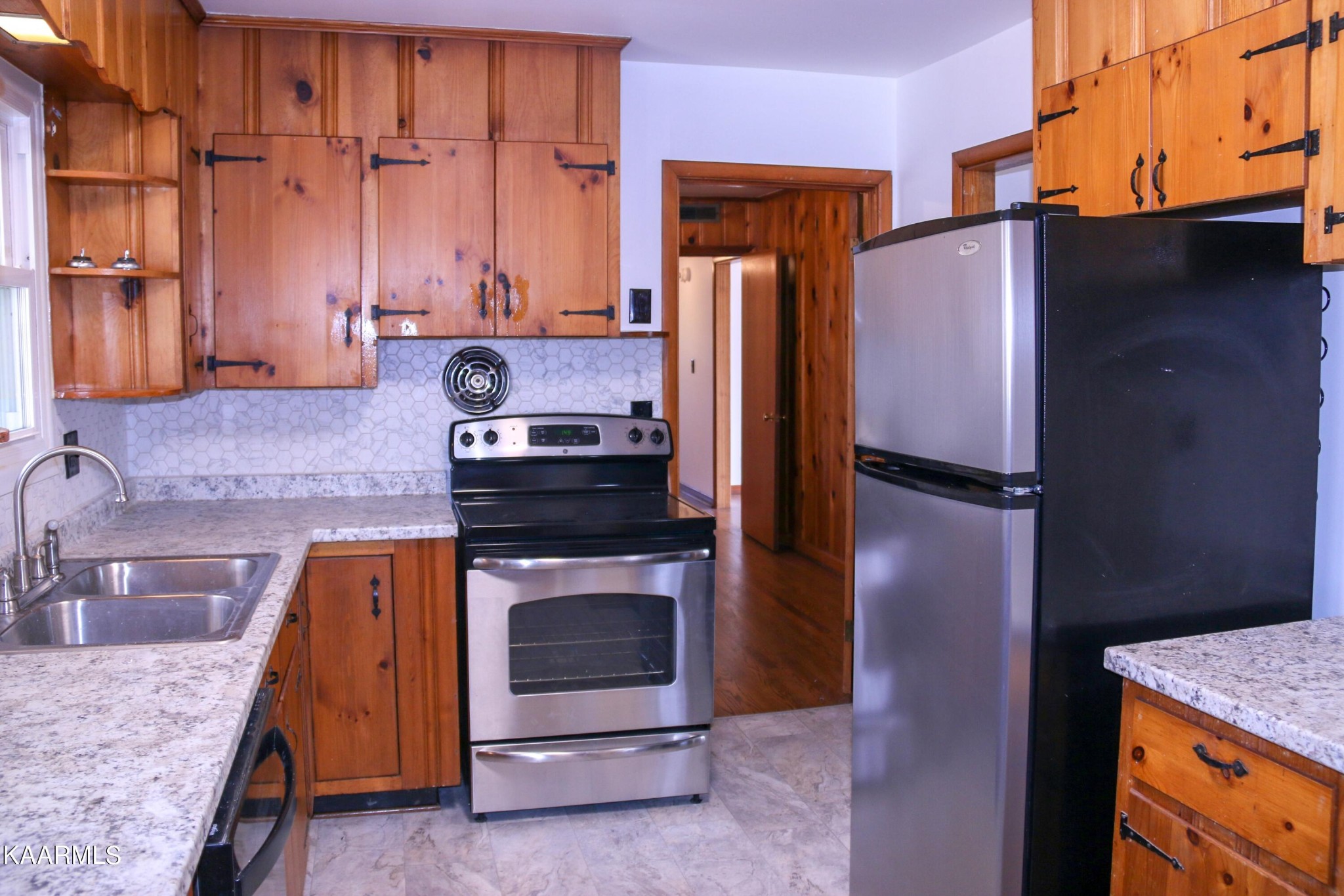 212 Kasson Road Knoxville, TN 37920 - Photo 5 of 22 a kitchen with stainless steel appliances granite countertop a refrigerator a stove and sink