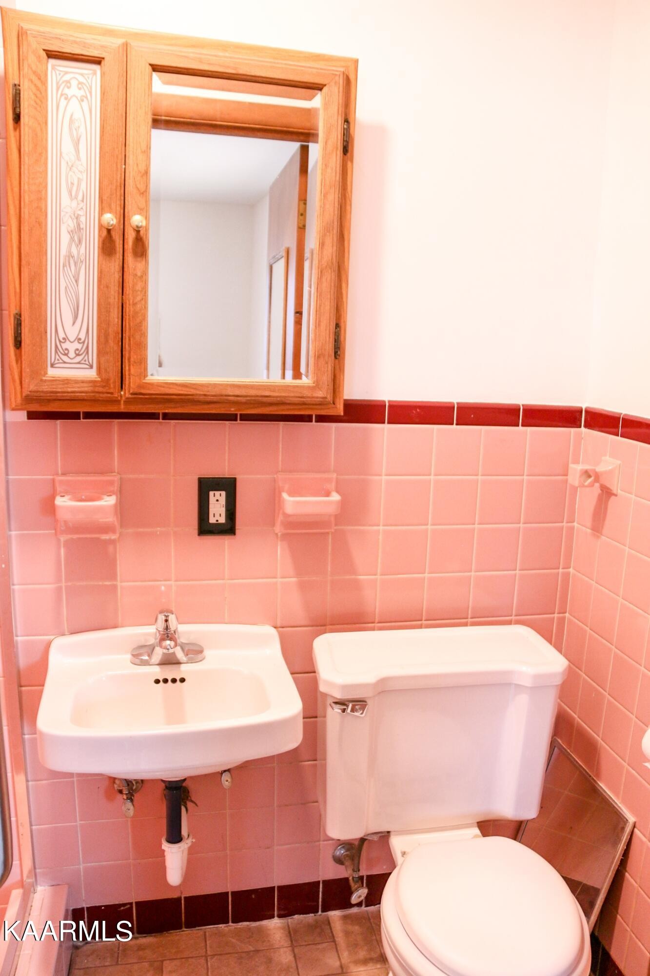 212 Kasson Road Knoxville, TN 37920 - Photo 9 of 22 a bathroom with a sink a toilet and mirror