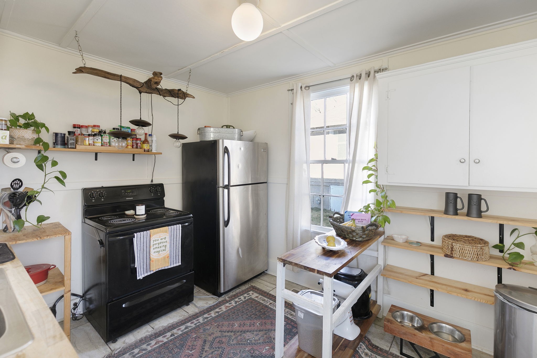 1409 Overton Street Old Hickory, TN 37138 - Photo 14 of 33 a kitchen with stainless steel appliances granite countertop a refrigerator and a stove top oven