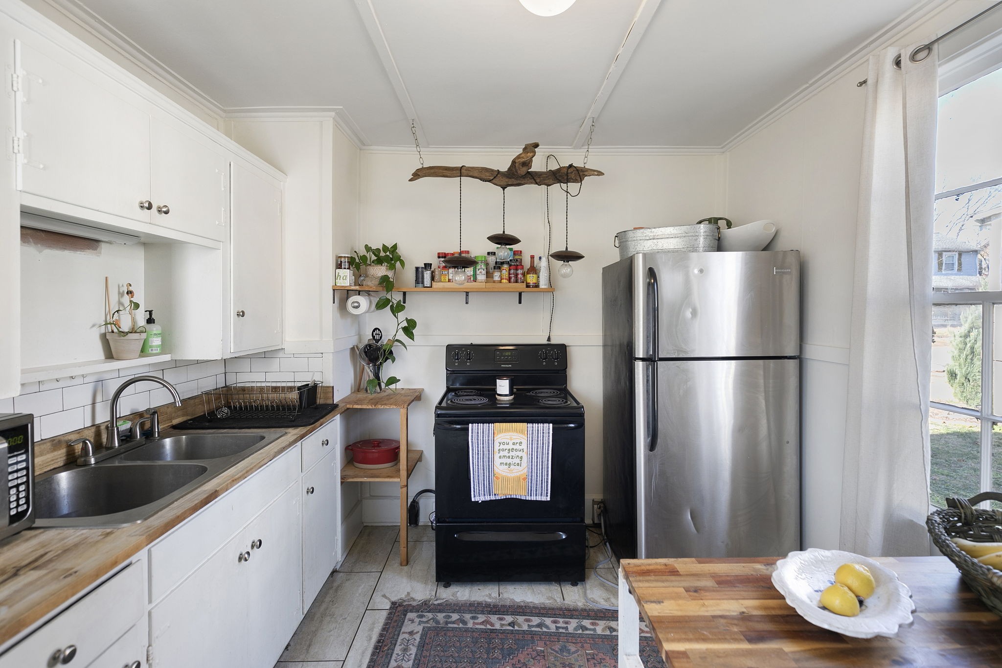 1409 Overton Street Old Hickory, TN 37138 - Photo 15 of 33 a kitchen with a refrigerator and a sink