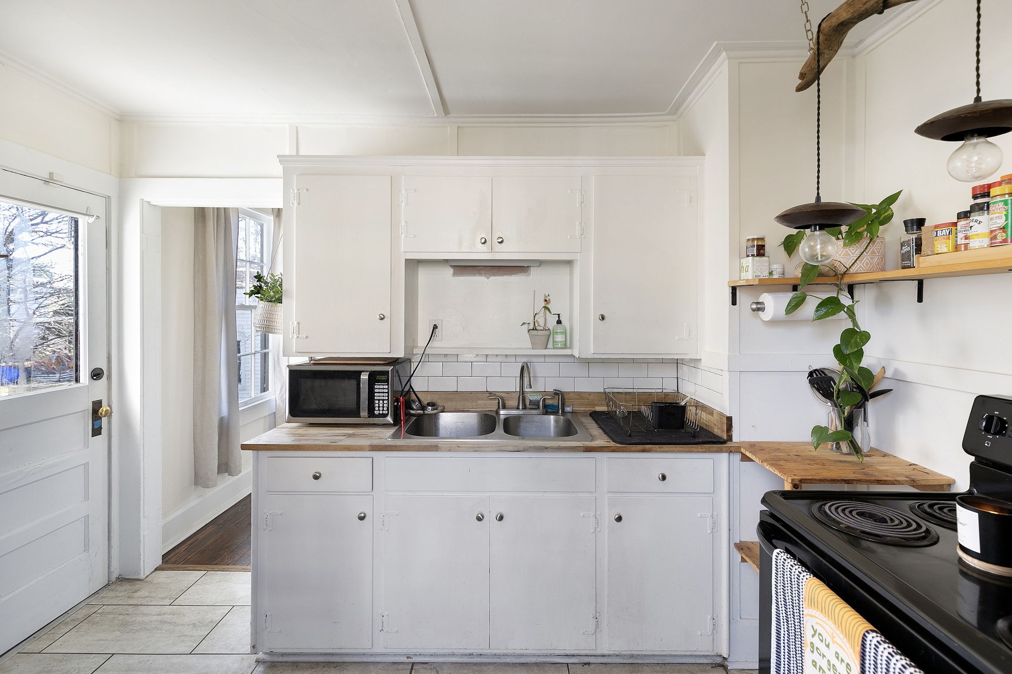 1409 Overton Street Old Hickory, TN 37138 - Photo 17 of 33 a kitchen with stainless steel appliances granite countertop a sink a stove and a refrigerator