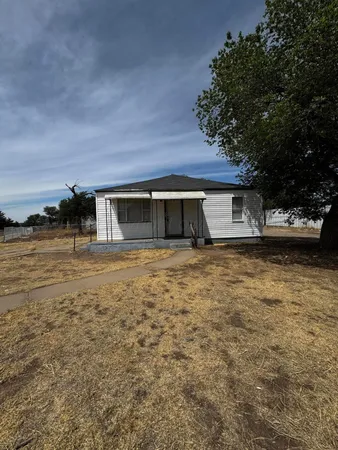 front view of house with a yard