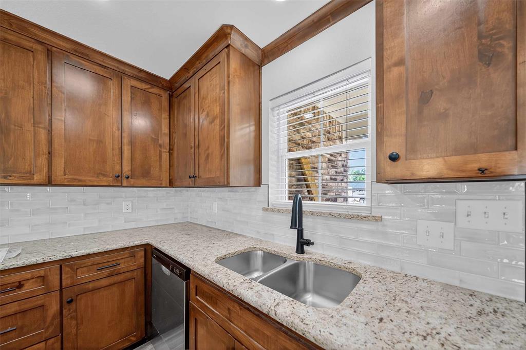 926 South Academy Avenue Tyler, TX 75701 - Photo 16 of 33 a kitchen with a sink cabinets and window